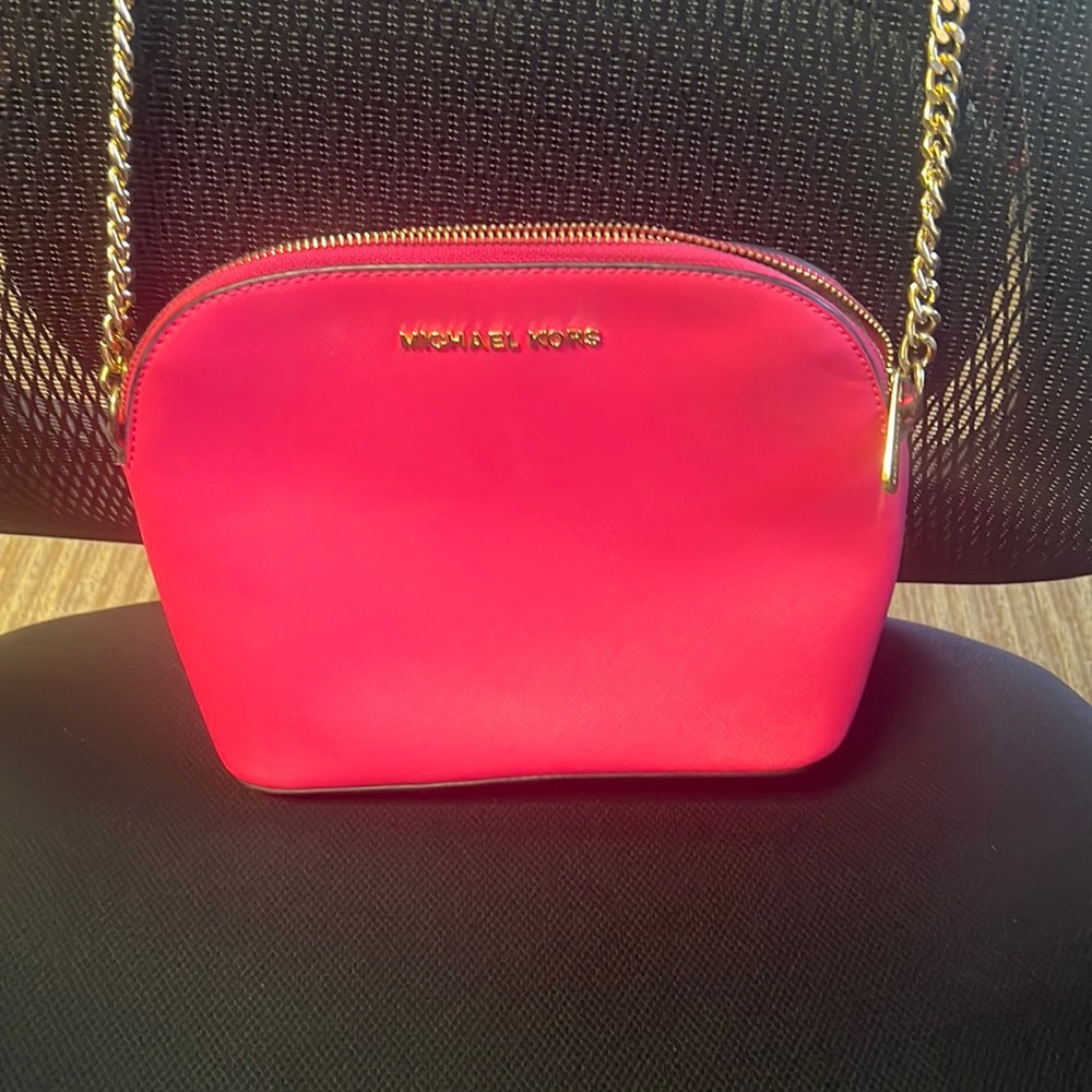 Pink with gold letters and chain Michael Kors Cross body purse medium size